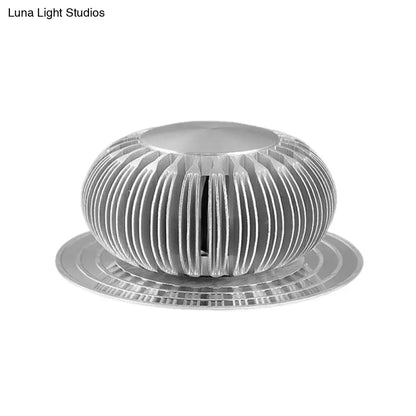 Silver Starburst Wall Sconce, round ribbed silver metal with radial fins and circular base on Tampa Home & Garden Store