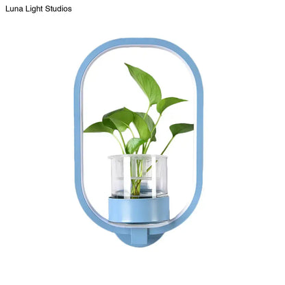Modern blue metal wall light with integrated plant pot and LED sconce by Decorbites on Tampa Home & Garden Store