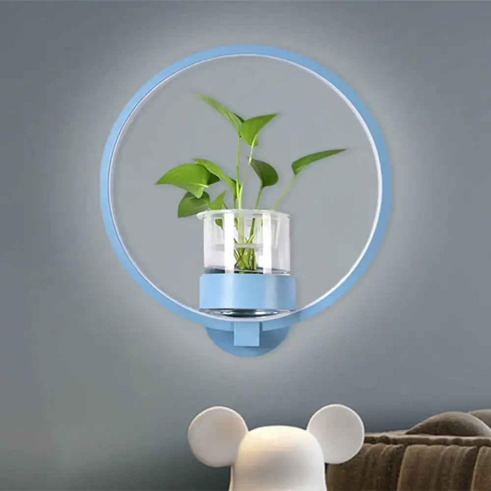 Round blue LED wall sconce with a clear glass plant pot holding a green plant, Decorbites on Tampa Home & Garden Store