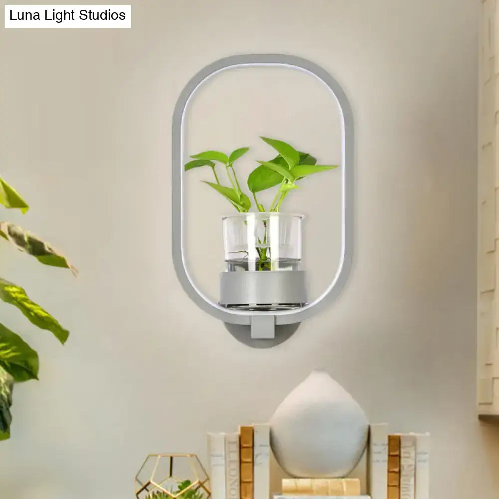 Modern silver wall light with oval frame and glass plant pot LED bedroom sconce Decorbites on Tampa Home & Garden Store