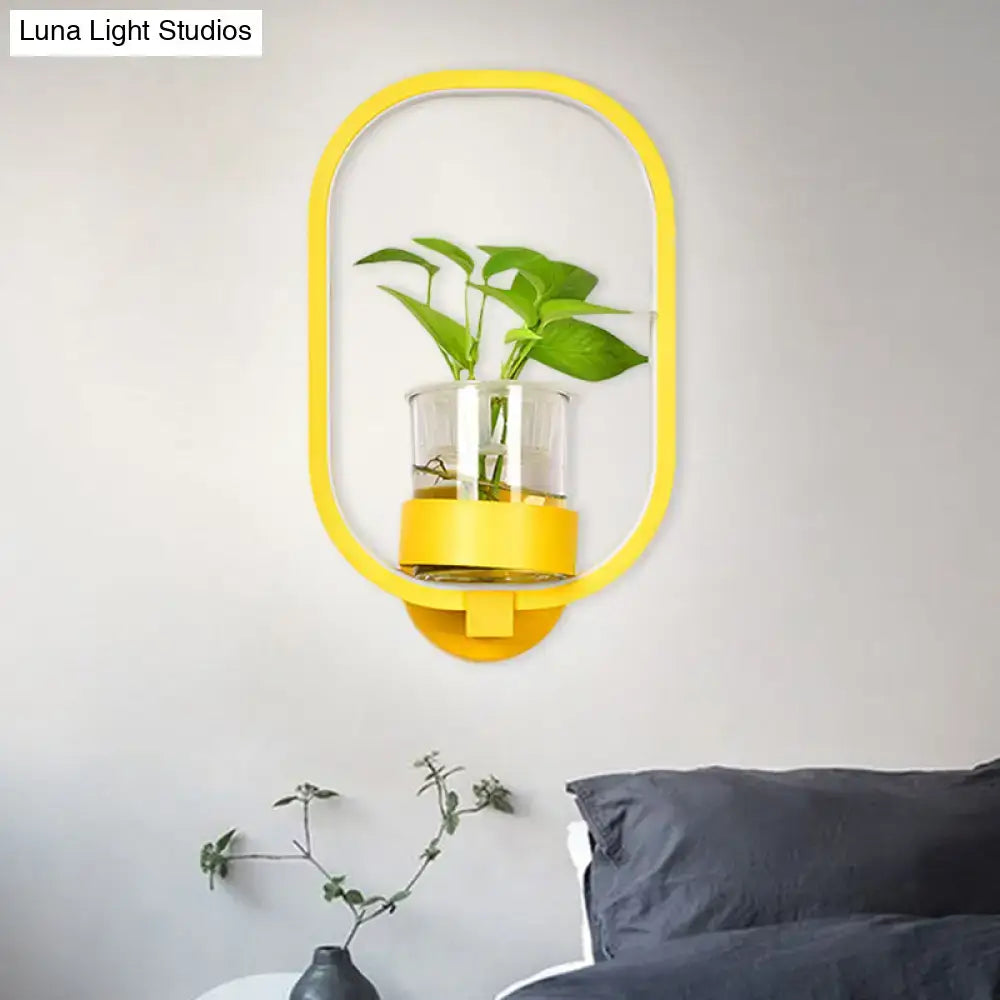 Yellow oval LED wall sconce with glass plant pot for bedroom décor on Tampa Home & Garden Store