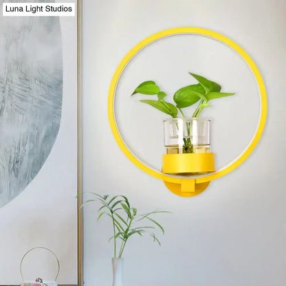 Modern circular yellow wall light with glass plant pot and greenery, Decorbites LED sconce on Tampa Home & Garden Store