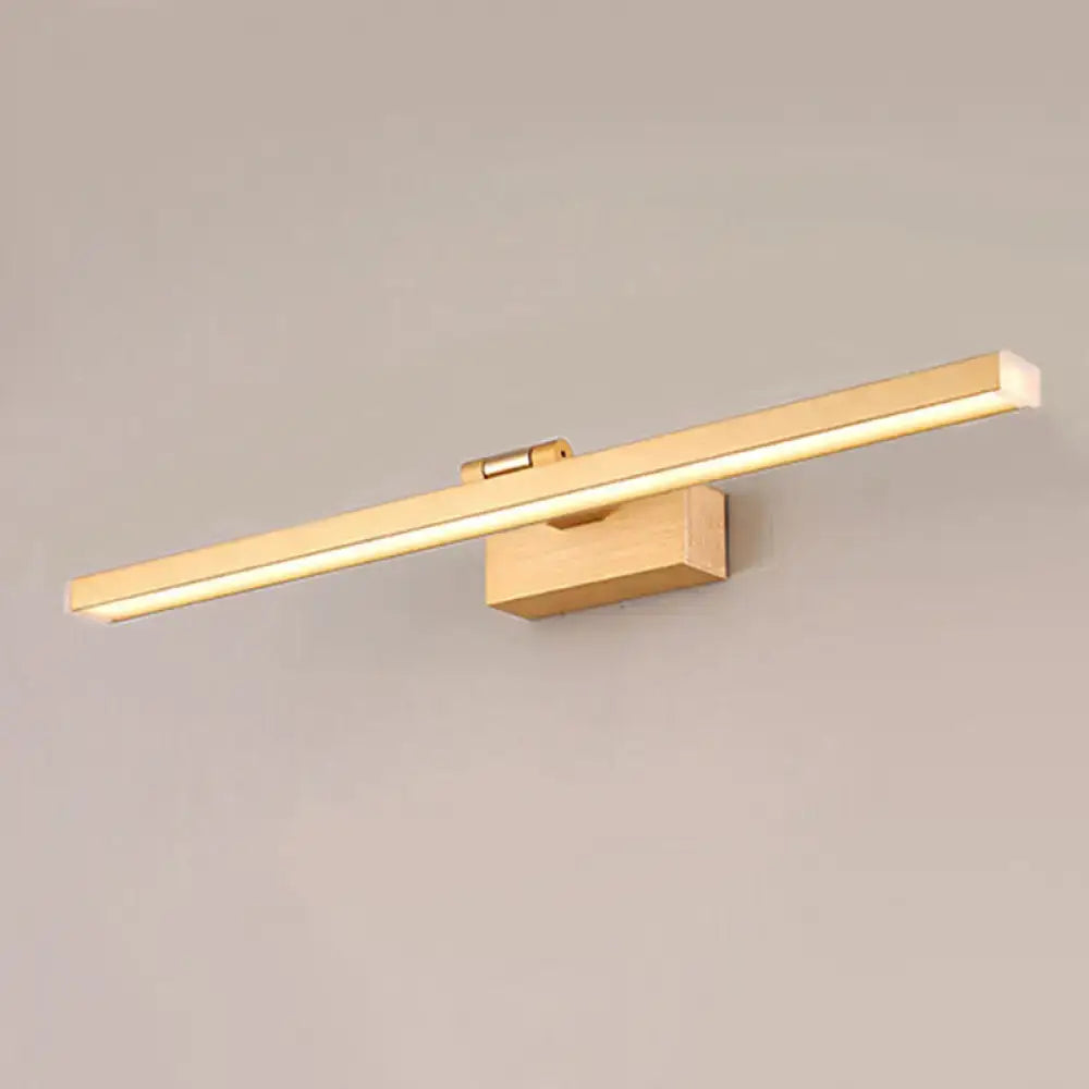 Gold brass linear vanity light with wood grain wall mount and warm LED glow on Tampa Home & Garden Store