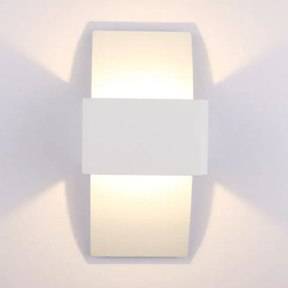 White LED warm compact sconce by Decorbites with rectangular panels emitting soft light on Tampa Home & Garden Store