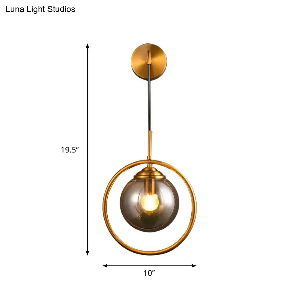 Gray Glass Globe Sconce by Decorbites, brass ring frame with gray globe, 19.5 in tall x 10 in wide on Tampa Home & Garden Store