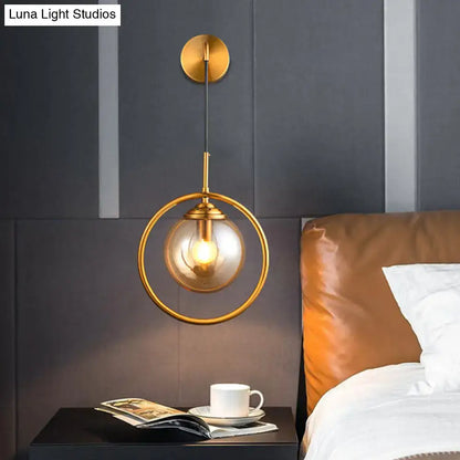 Gray Glass Globe Sconce by Decorbites, brass wall light with circular ring and glass globe on Tampa Home & Garden Store
