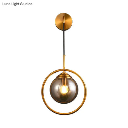 Gray Glass Globe Sconce Decorbites, gold ring frame, black suspension cord on Tampa Home & Garden Store