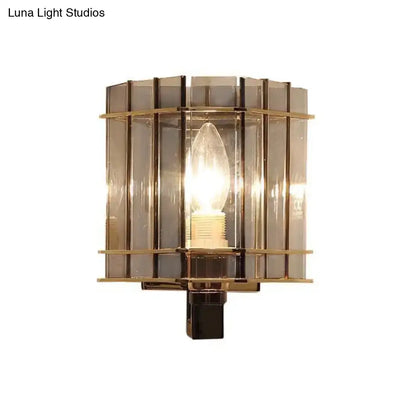 Gray glass rectangular frame sconce with brass bands and exposed bulb by Decorbites on Tampa Home & Garden Store