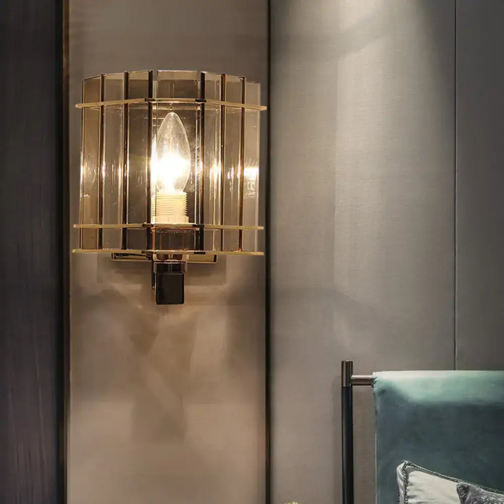 Decorbites gray glass rectangular frame sconce with brass grid and lit bulb on wall on Tampa Home & Garden Store