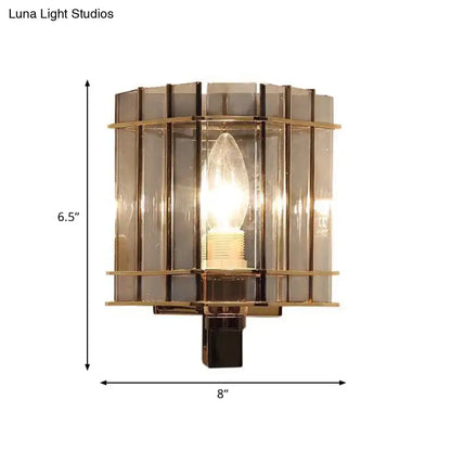 Gray glass rectangular frame sconce with brass accents and exposed bulb, 6.5 in tall by 8 in wide on Tampa Home & Garden Store
