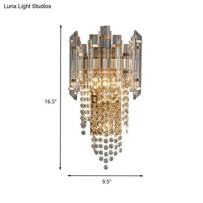 Gray crystal wall sconce with gold-tone metal accents and hanging crystal strands by Decorbites on Tampa Home & Garden Store