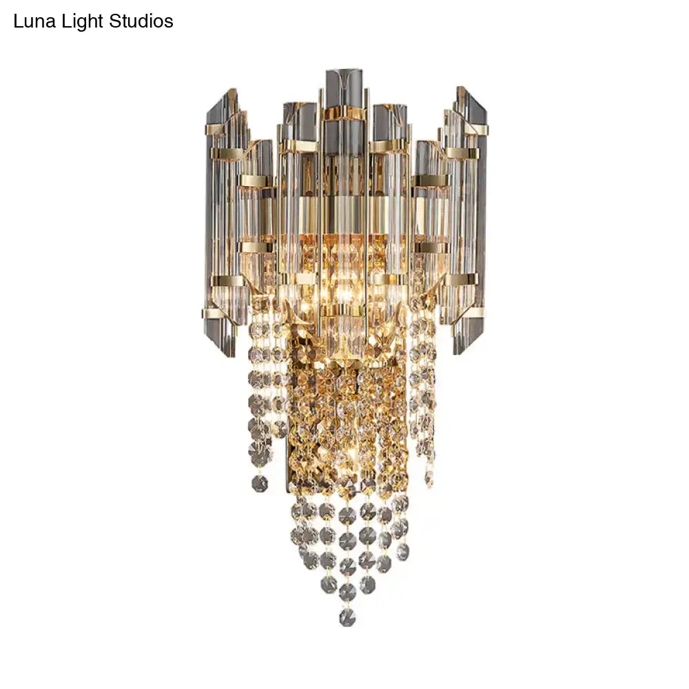 Gray crystal wall sconce with gold-tone frame and hanging crystal strands on Tampa Home & Garden Store