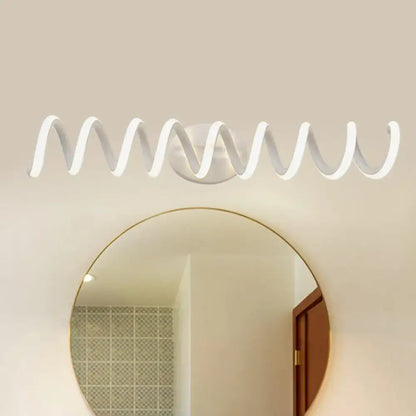 Modern spiral wall light sconce Decorbites for bathroom with warm LED glow above mirror on Tampa Home & Garden Store
