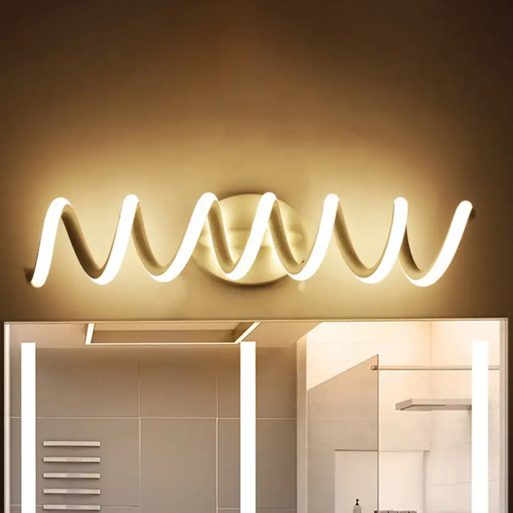 Modern spiral white LED bathroom wall sconce by Decorbites with warm glow above mirror on Tampa Home & Garden Store