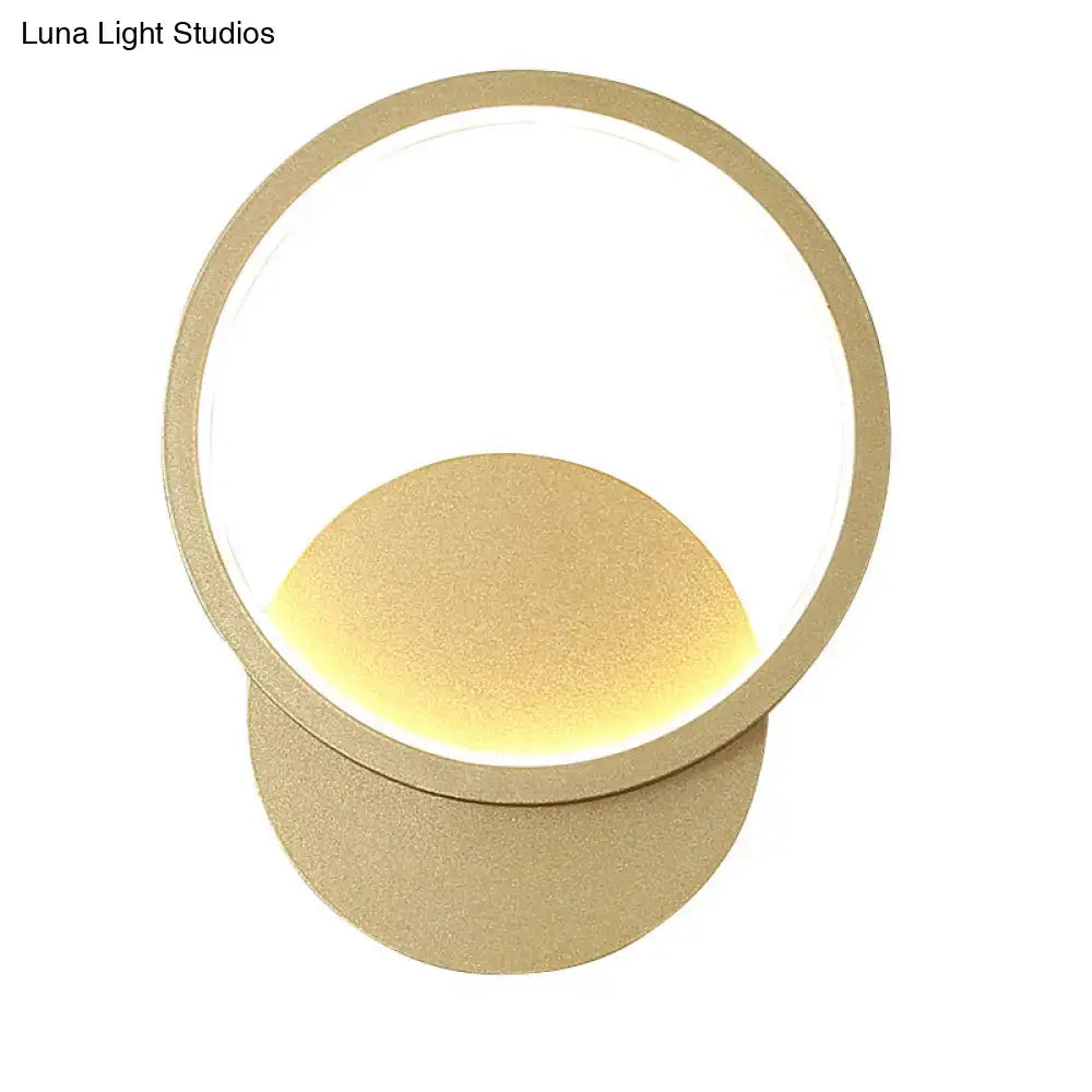 Wall sconce with circular gold ring and warm LED glow by Decorbites on Tampa Home & Garden Store