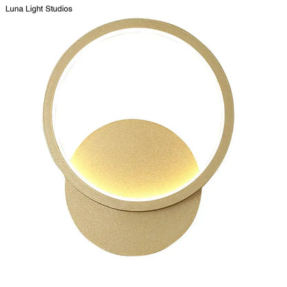Wall sconce with circular gold ring and warm LED glow by Decorbites on Tampa Home & Garden Store