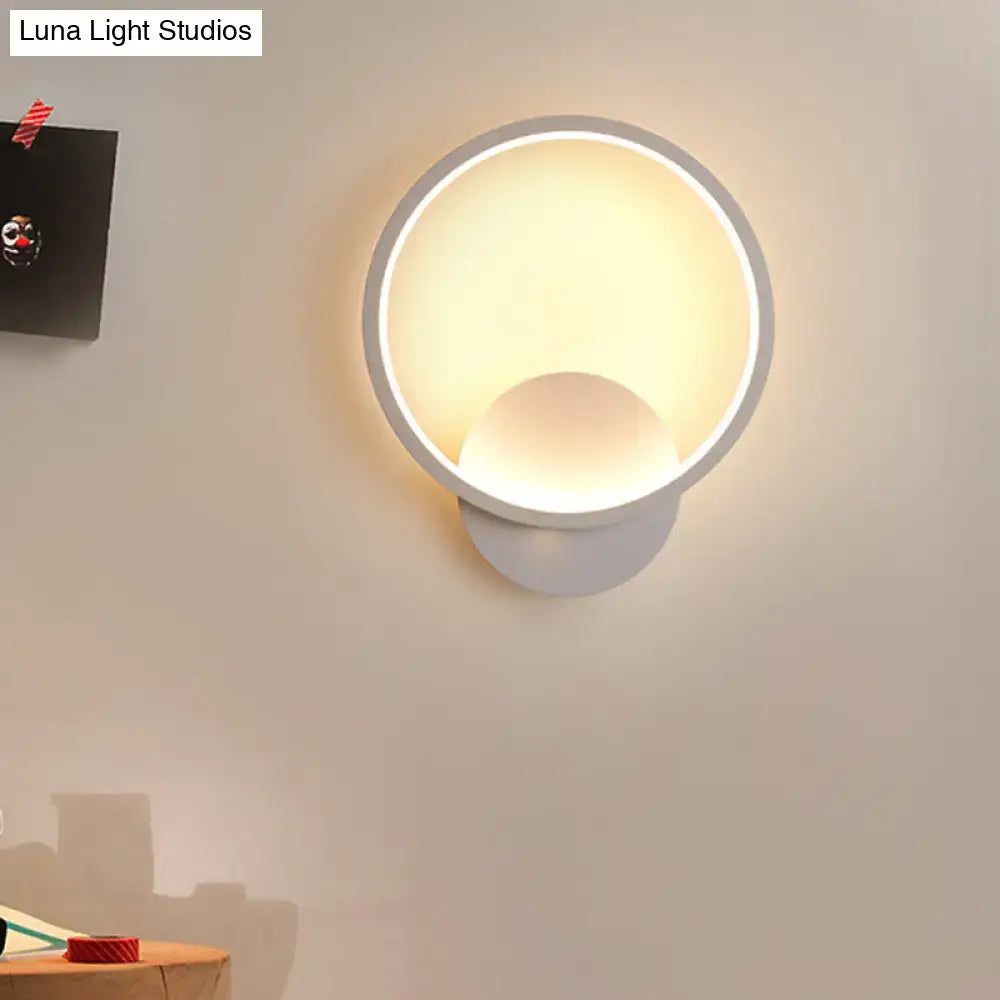 White circular wall sconce with glowing ring, modern Decorbites lighting on Tampa Home & Garden Store
