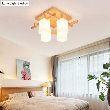 White wood flush mount ceiling light with three frosted cube shades on Tampa Home & Garden Store