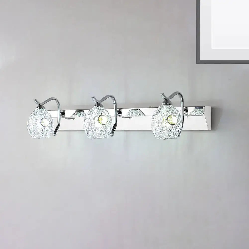 Stainless steel vanity light with three crackle glass globe shades on a chrome bar on Tampa Home & Garden Store