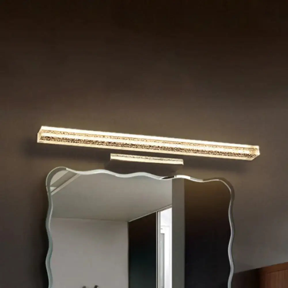 Decorbites stainless LED bathroom sconce over a wave-edged mirror on Tampa Home & Garden Store