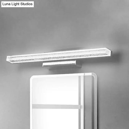 Stainless LED bathroom sconce by Decorbites with slim bar design mounted above mirror on Tampa Home & Garden Store