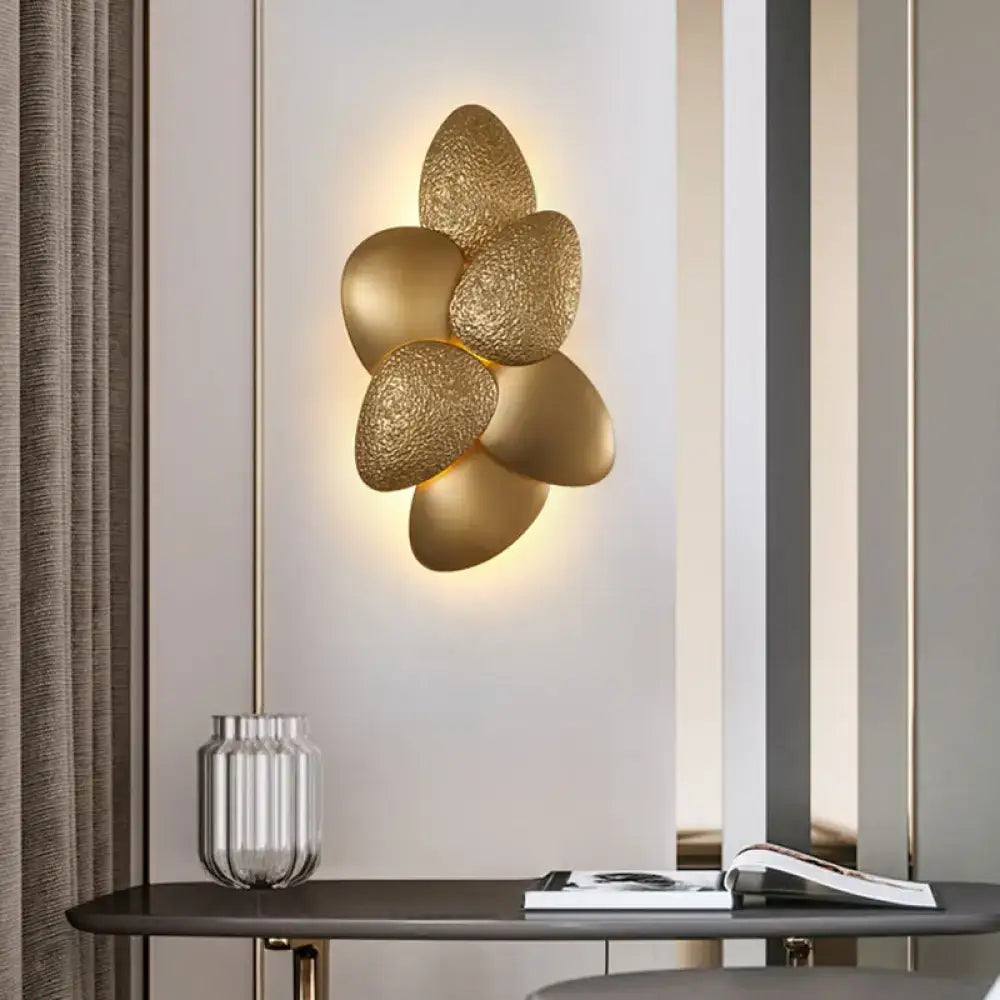 Decorbites Gold Squama Wall Sconce with petal-shaped brass leaves and warm backlight on Tampa Home & Garden Store