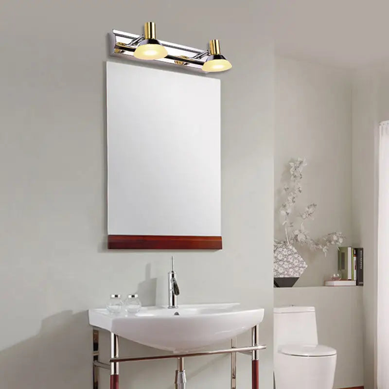 Chrome gold vanity light by Decorbites with dual lamps over bathroom mirror and sink on Tampa Home & Garden Store