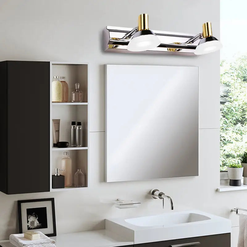 Chrome Gold vanity light fixture Decorbites with two white glass shades over vanity mirror on Tampa Home & Garden Store
