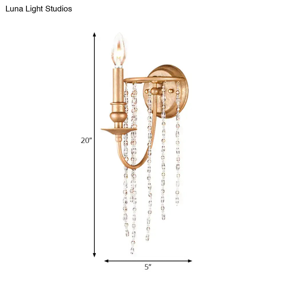 Copper crystal beaded sconce with candle-style bulb and hanging crystal strands, gold finish on Tampa Home & Garden Store