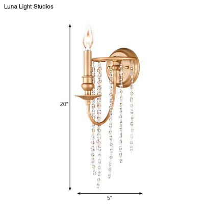 Copper crystal beaded sconce with candle-style bulb and hanging crystal strands, gold finish on Tampa Home & Garden Store