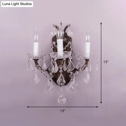 White Rust Crystal Sconce with three candle bulbs and hanging prisms on bronze mount on Tampa Home & Garden Store
