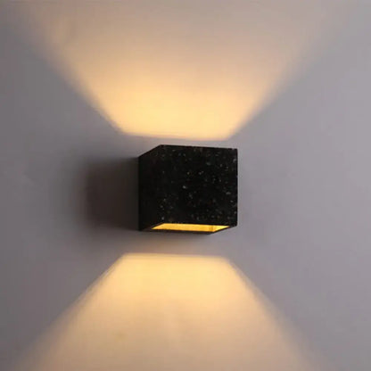Decorbites Terrazzo Square Wall Sconce, black terrazzo cube wall light with warm glow on Tampa Home & Garden Store