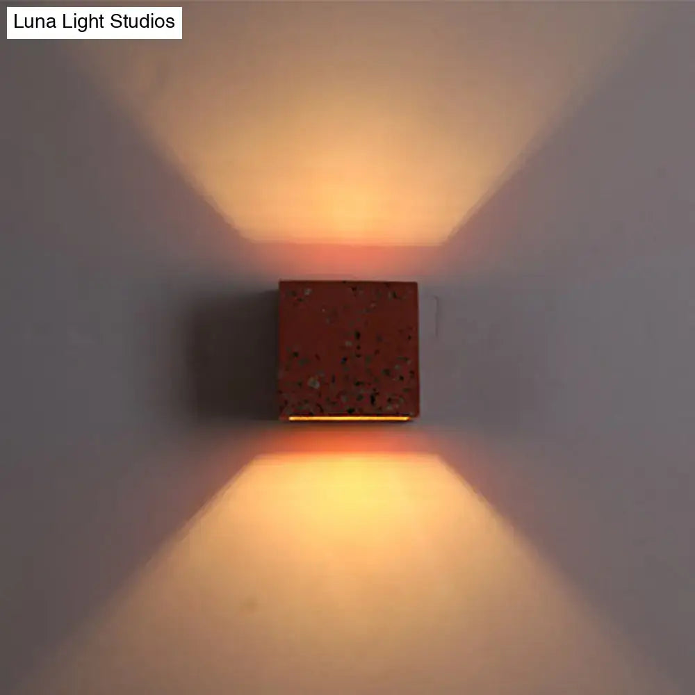 Terrazzo square wall sconce by Decorbites, red speckled cube casting warm up/down light on Tampa Home & Garden Store