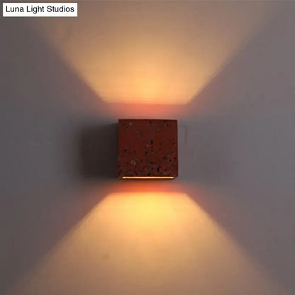 Terrazzo square wall sconce by Decorbites, red speckled cube casting warm up/down light on Tampa Home & Garden Store