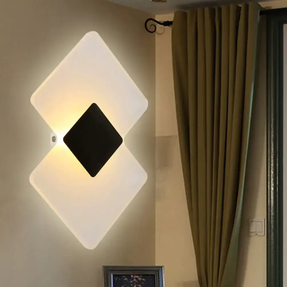 Silver Black LED Sconce with white diamond panels and a black center diamond, warm glow on Tampa Home & Garden Store