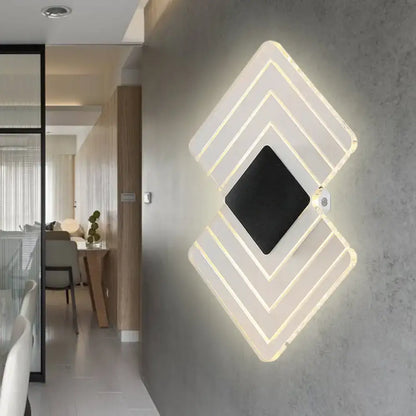 Decorbites silver LED wall sconce with layered diamond frames and black center on Tampa Home & Garden Store