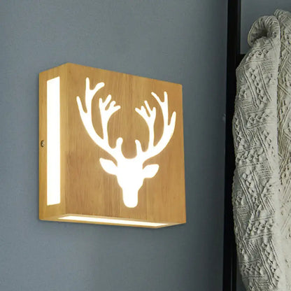 Decorbites bamboo wall light with square wooden panel and deer antler cutout, wall mounted on Tampa Home & Garden Store