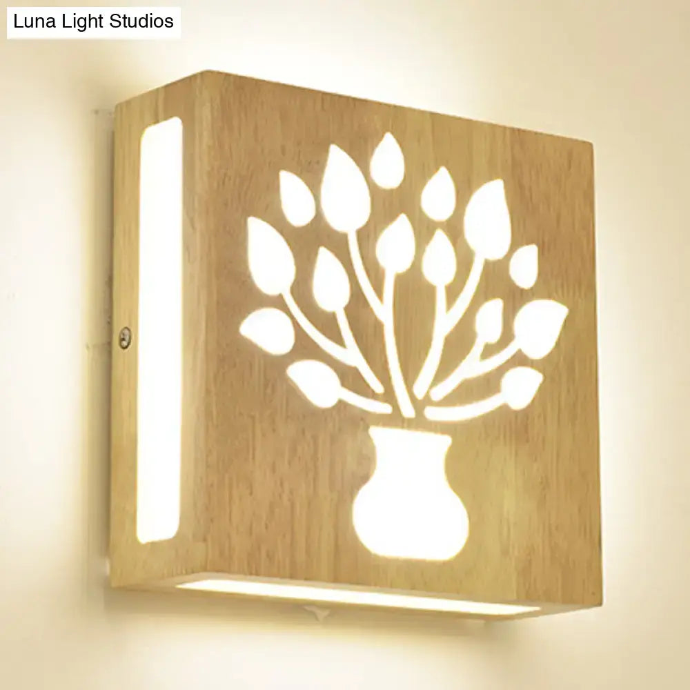 Modern bamboo wall light with tree pattern and vase silhouette cutout on natural wood on Tampa Home & Garden Store