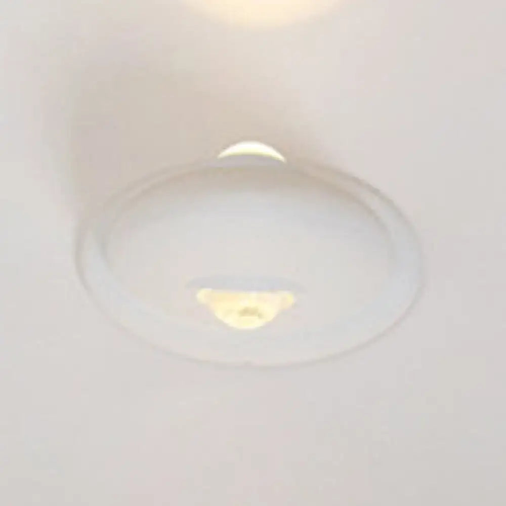 White chrome wall sconce with round glass globe on Tampa Home & Garden Store