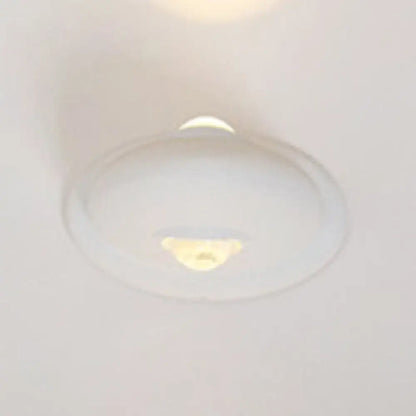 White chrome wall sconce with round glass globe on Tampa Home & Garden Store