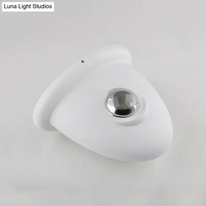 White chrome wall sconce with curved backplate and circular chrome spotlight by Decorbites on Tampa Home & Garden Store