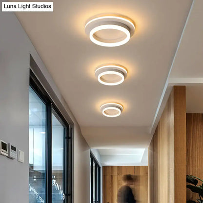 Modern tricolor ring LED flush mount ceiling lights in hallway with circular rings on Tampa Home & Garden Store