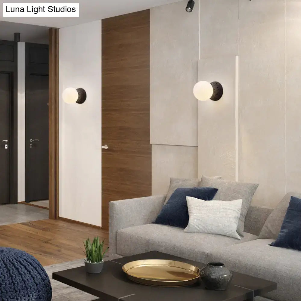 Stone Glass Wall Lamp pair by Decorbites on a white panel wall in a modern living room on Tampa Home & Garden Store