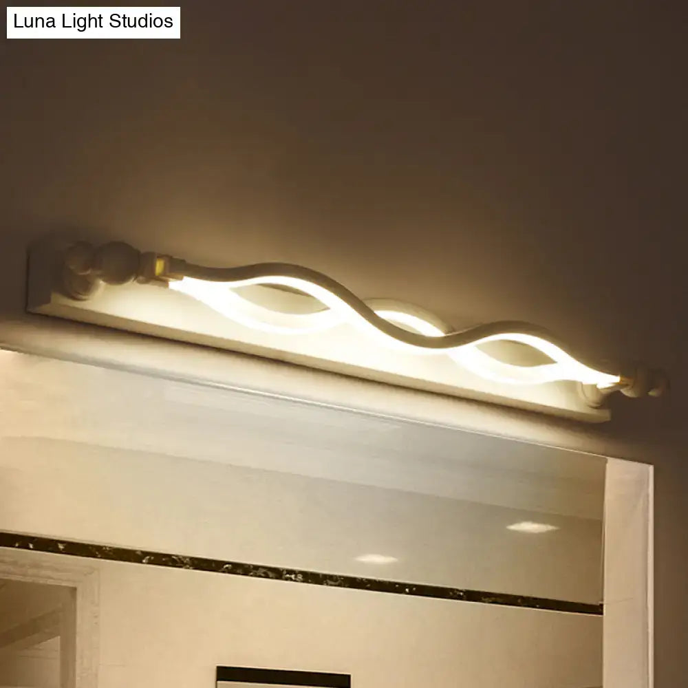 Modern wavy white twist acrylic vanity sconce by Decorbites above bathroom mirror on Tampa Home & Garden Store