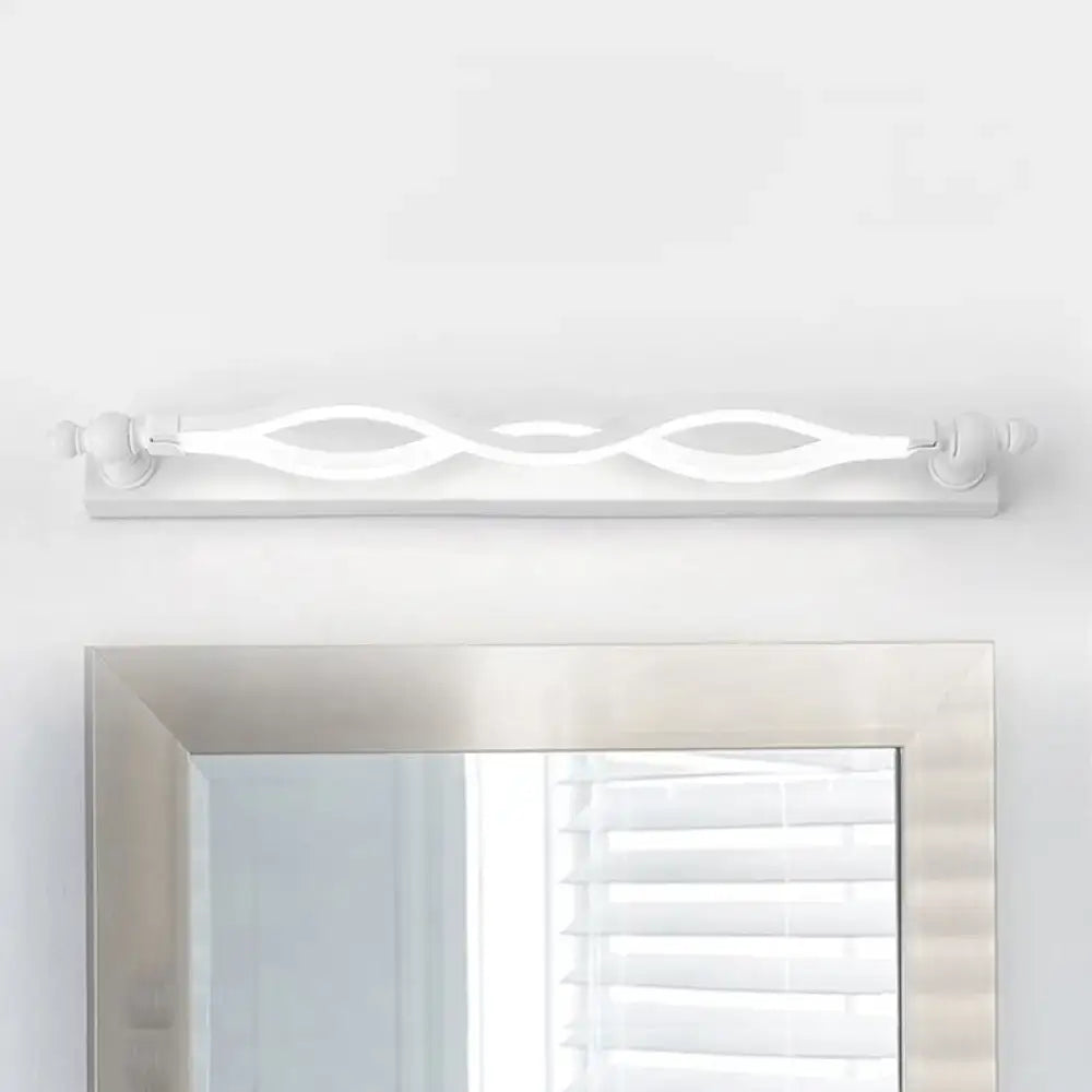 Modern wavy white twist acrylic vanity sconce by Decorbites over a silver mirror on Tampa Home & Garden Store