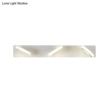 White adjustable wall light by Decorbites with a rectangular backplate and three angled heads on Tampa Home & Garden Store