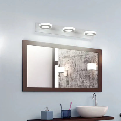 White adjustable wall light with three circular ring LEDs above bathroom mirror Decorbites on Tampa Home & Garden Store