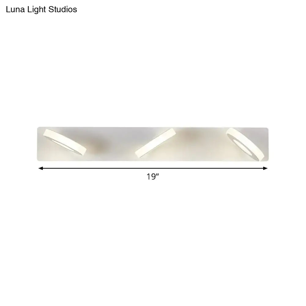 Decorbites white adjustable wall light with three angled spotlights on backplate on Tampa Home & Garden Store