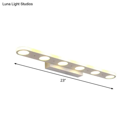 Decorbites white LED vanity wall light with multiple circular LEDs on a 23-inch bar on Tampa Home & Garden Store