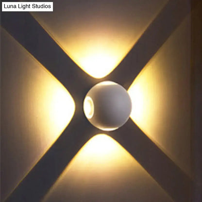 White Dome Wall Sconce by Decorbites with round glass shade on X-backplate, warm glow on Tampa Home & Garden Store